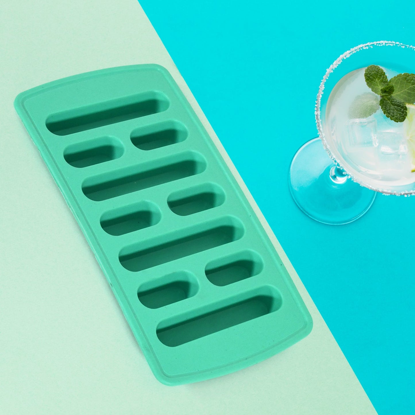 Freshly made ice cubes resting inside the ice tray, ready to be served.