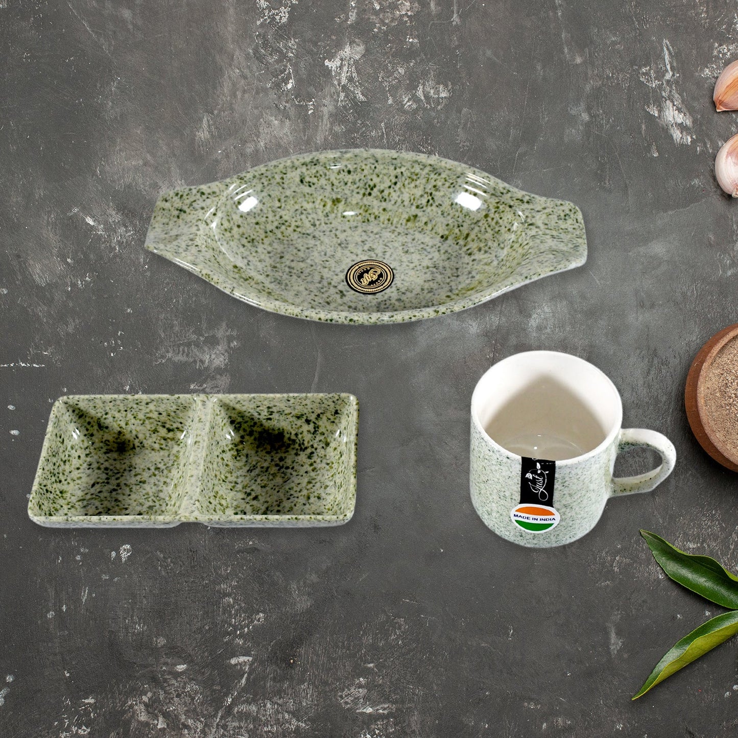 The versatile plastic snack platter and two-compartment chutney bowl from the Ceramic Snack & Tea Set, ready for serving.