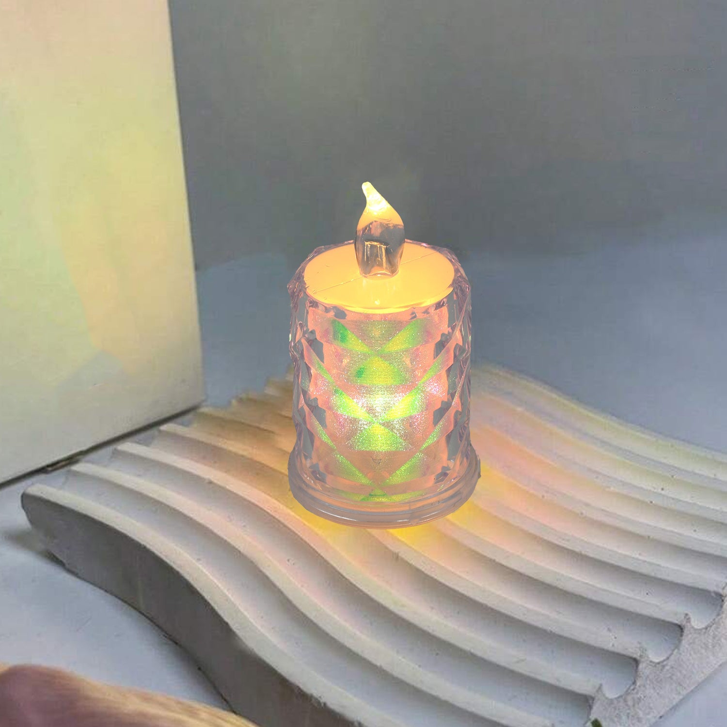 The 4-piece flameless LED candle set illuminates a dark setting, creating a festive atmosphere.