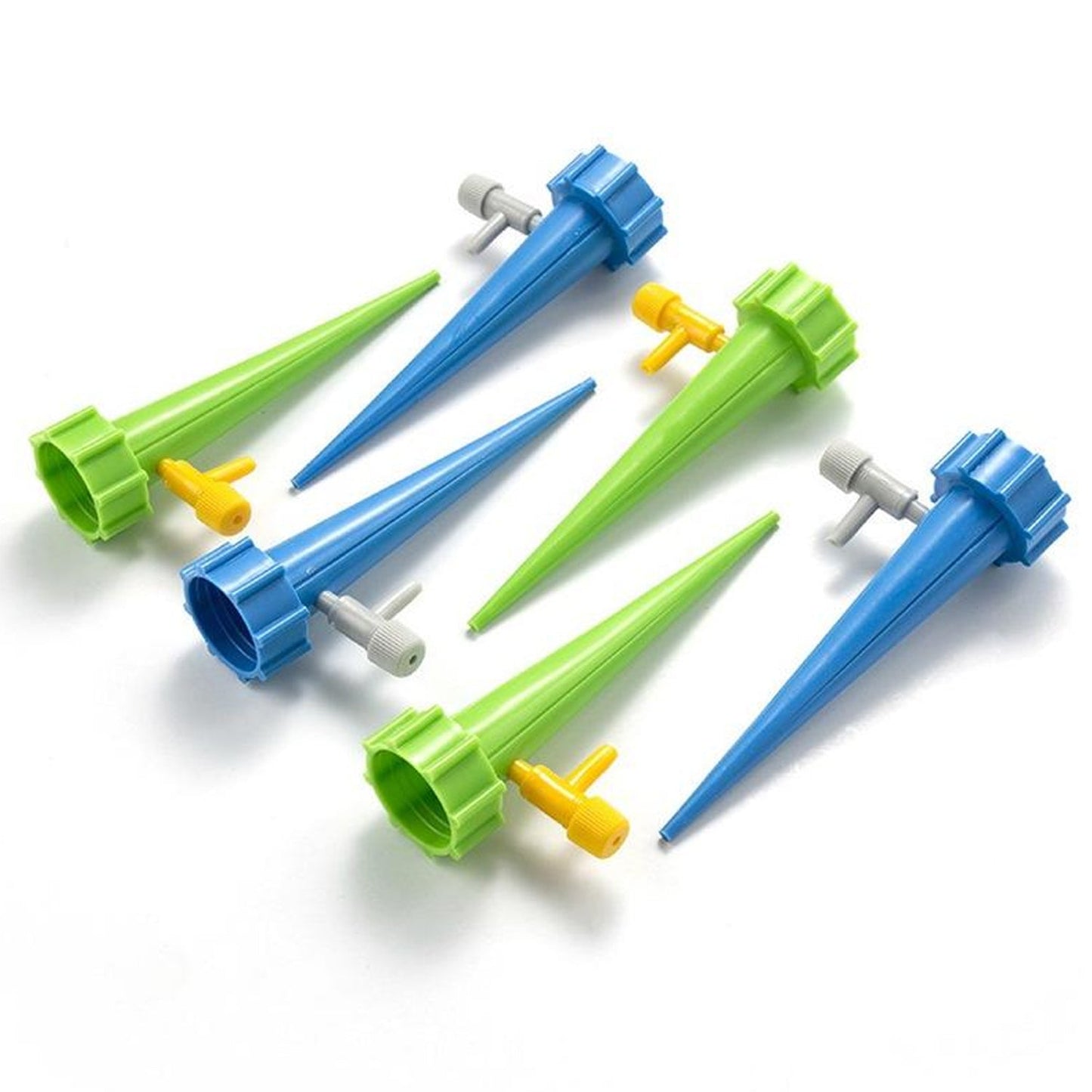 Plant watering spikes shown with a ruler to indicate their size.