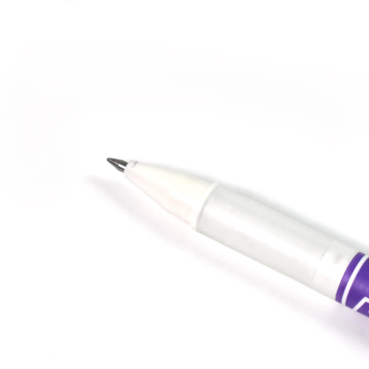Black gel pen with a subtle reflection on a smooth surface