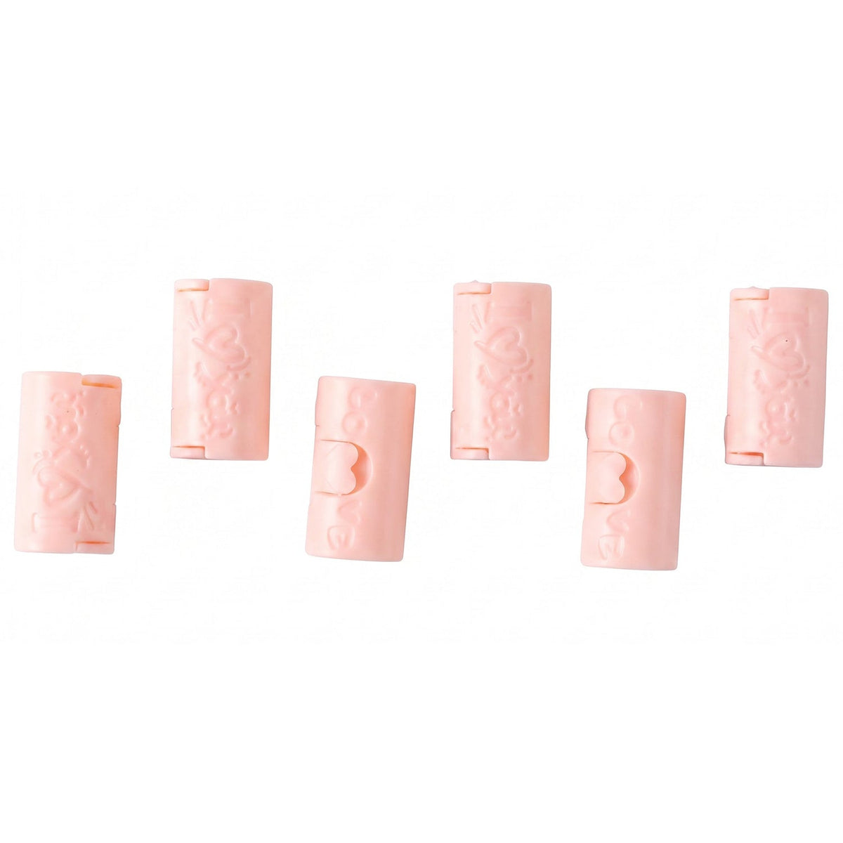Six pink plastic bed sheet clips with a 'Love' design are arranged on a plain white background.