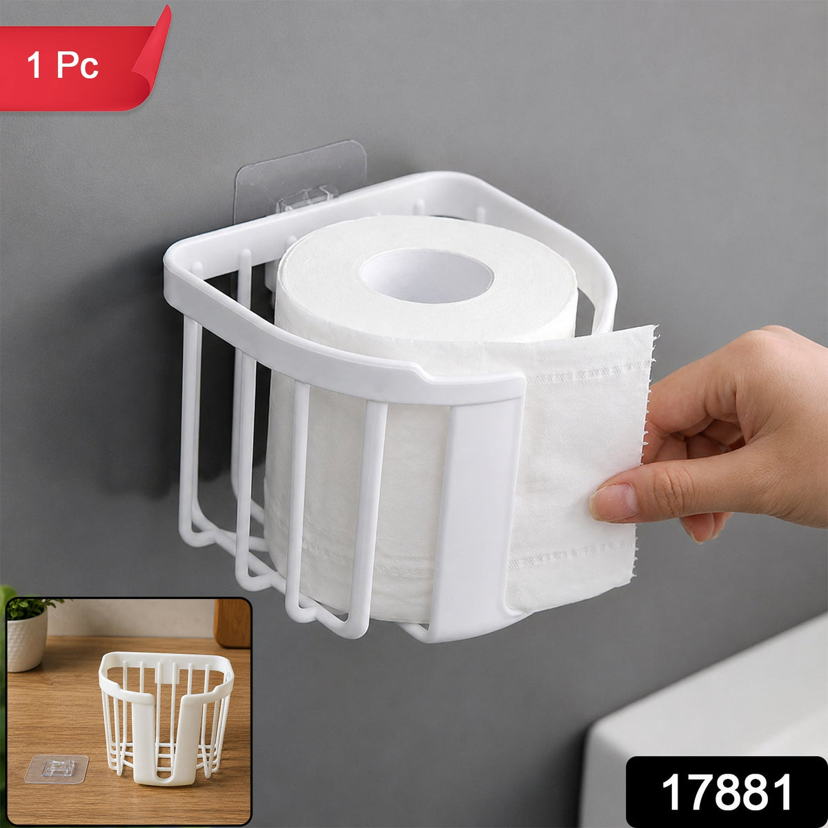 A white plastic toilet paper holder on a gray wall with a roll of toilet paper, a hand tearing a sheet, and red '1 Pc' and