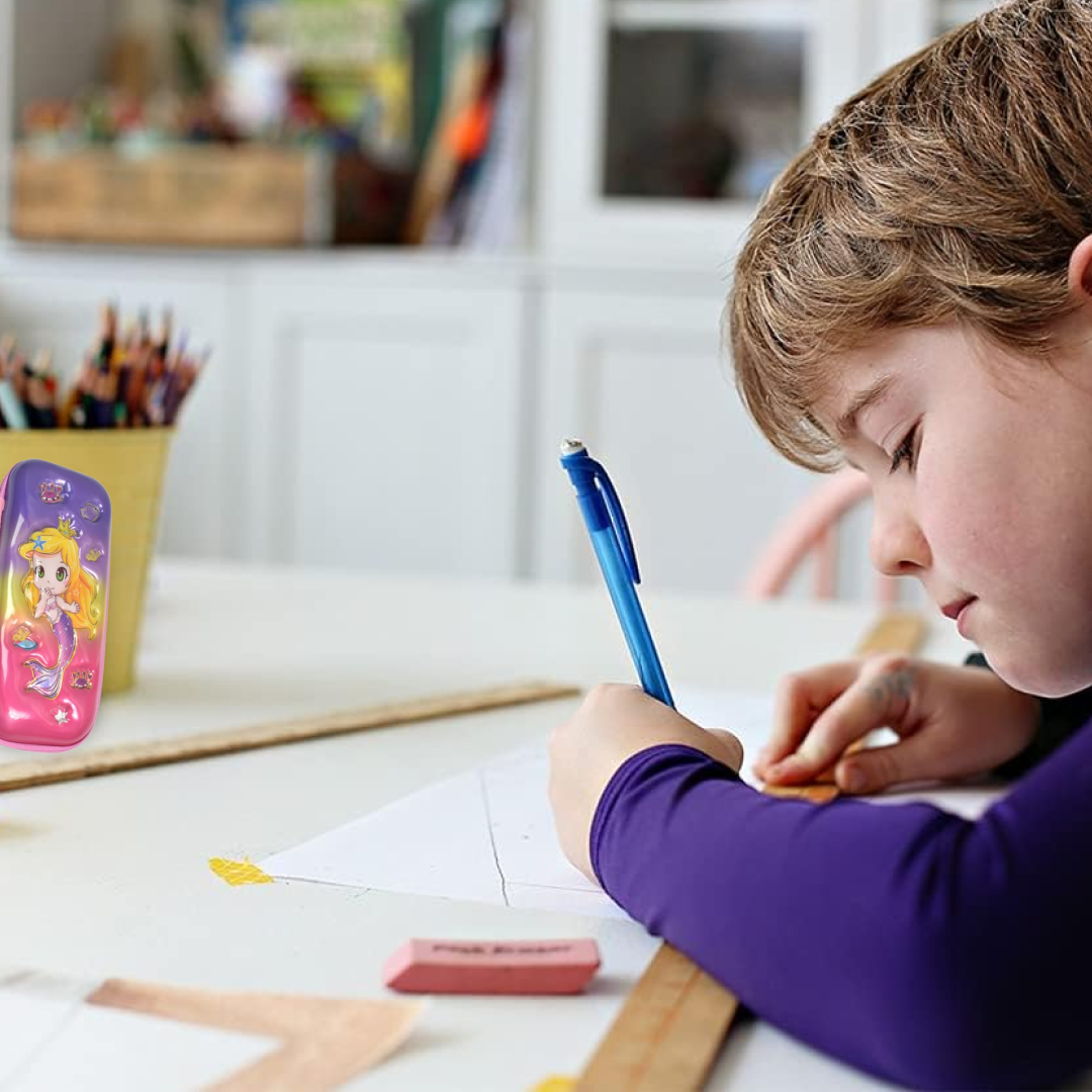 A child drawing with a blue pen and ruler, with a mermaid pencil case standing upright in the blurred background.