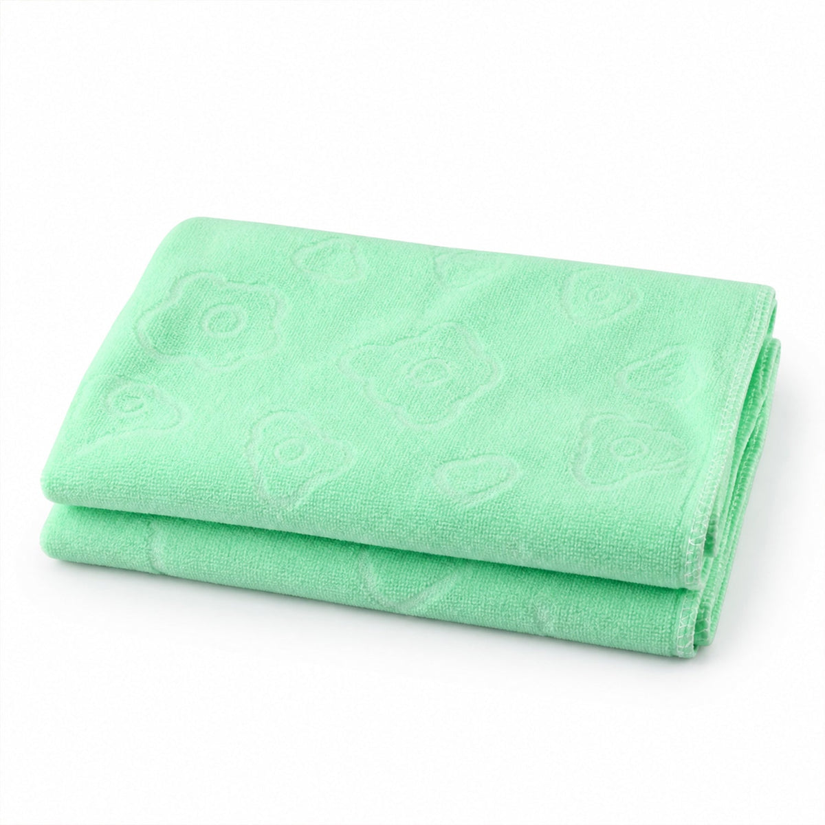 A light green microfiber towel with subtle embossed patterns, folded neatly on a white background.