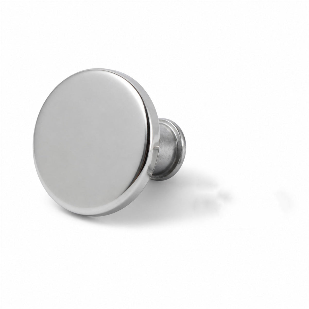 A single shiny silver metal button pin with a short post, casting a shadow on a white background.