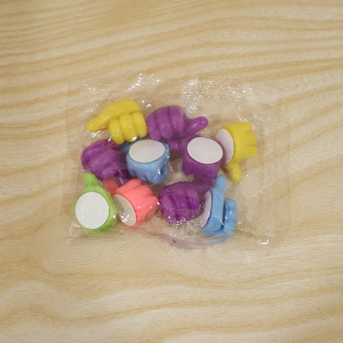 Live photo of the actual plastic packaging for the wire holder clips