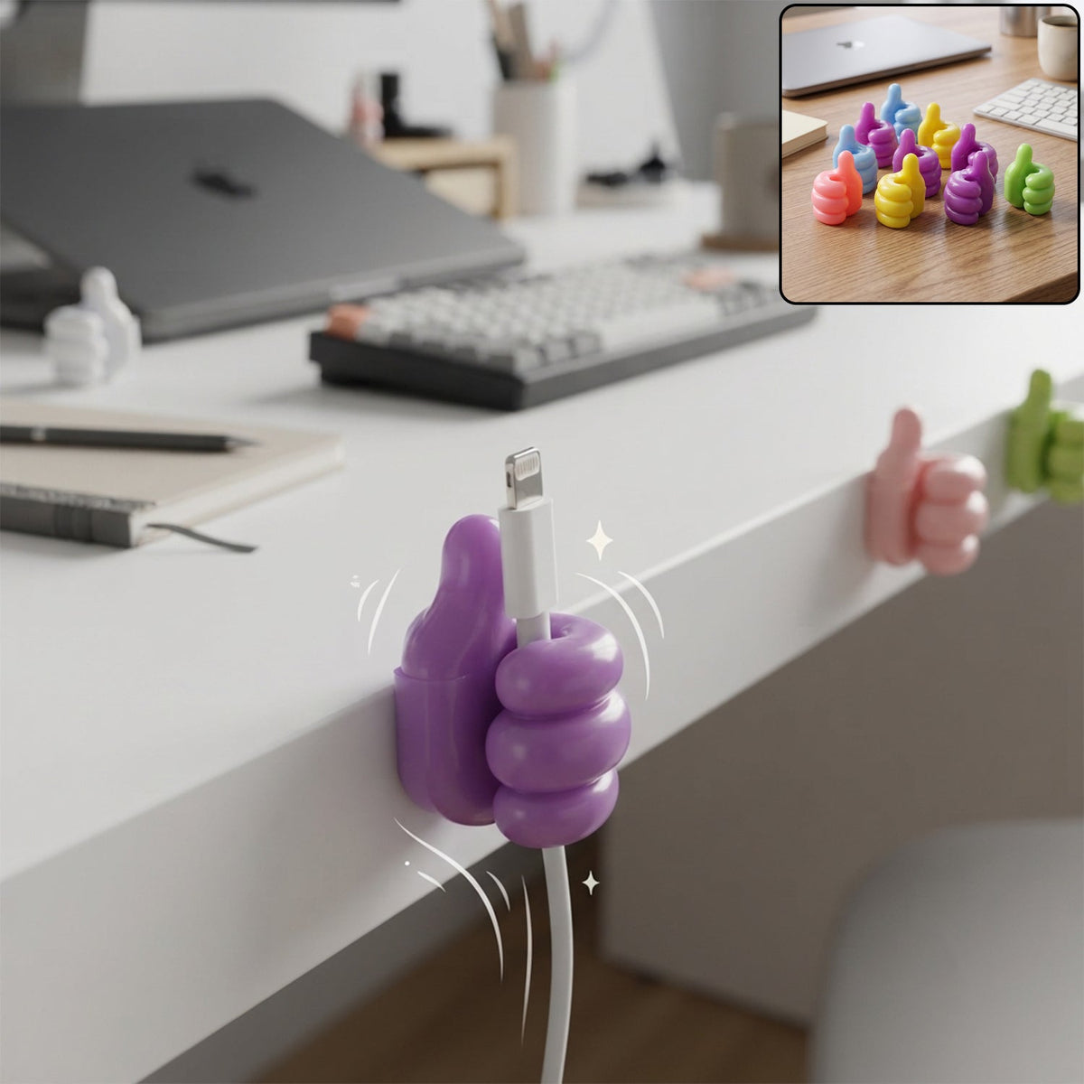 A purple thumbs-up clip holds a white charging cable to the side of a white desk, with other clips visible in the background.