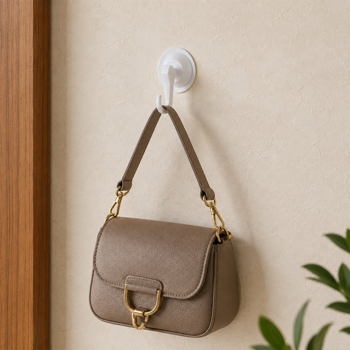 Multipurpose suction wall hook in use