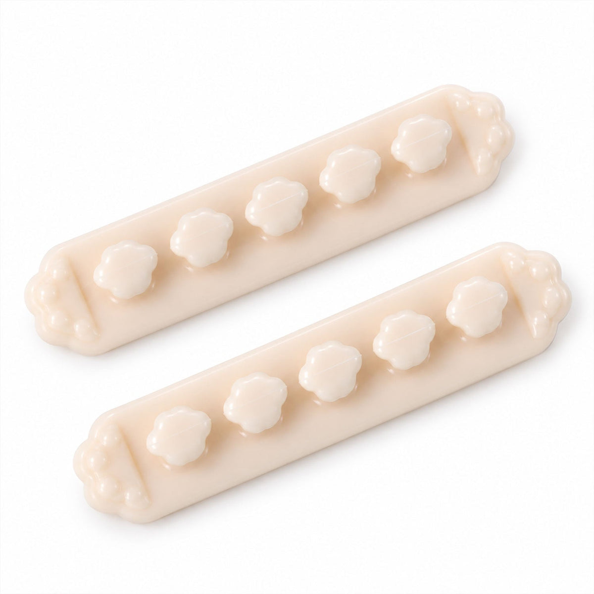Two beige flower-shaped cable organizer clips with five flower-shaped slots each, presented on a white background.