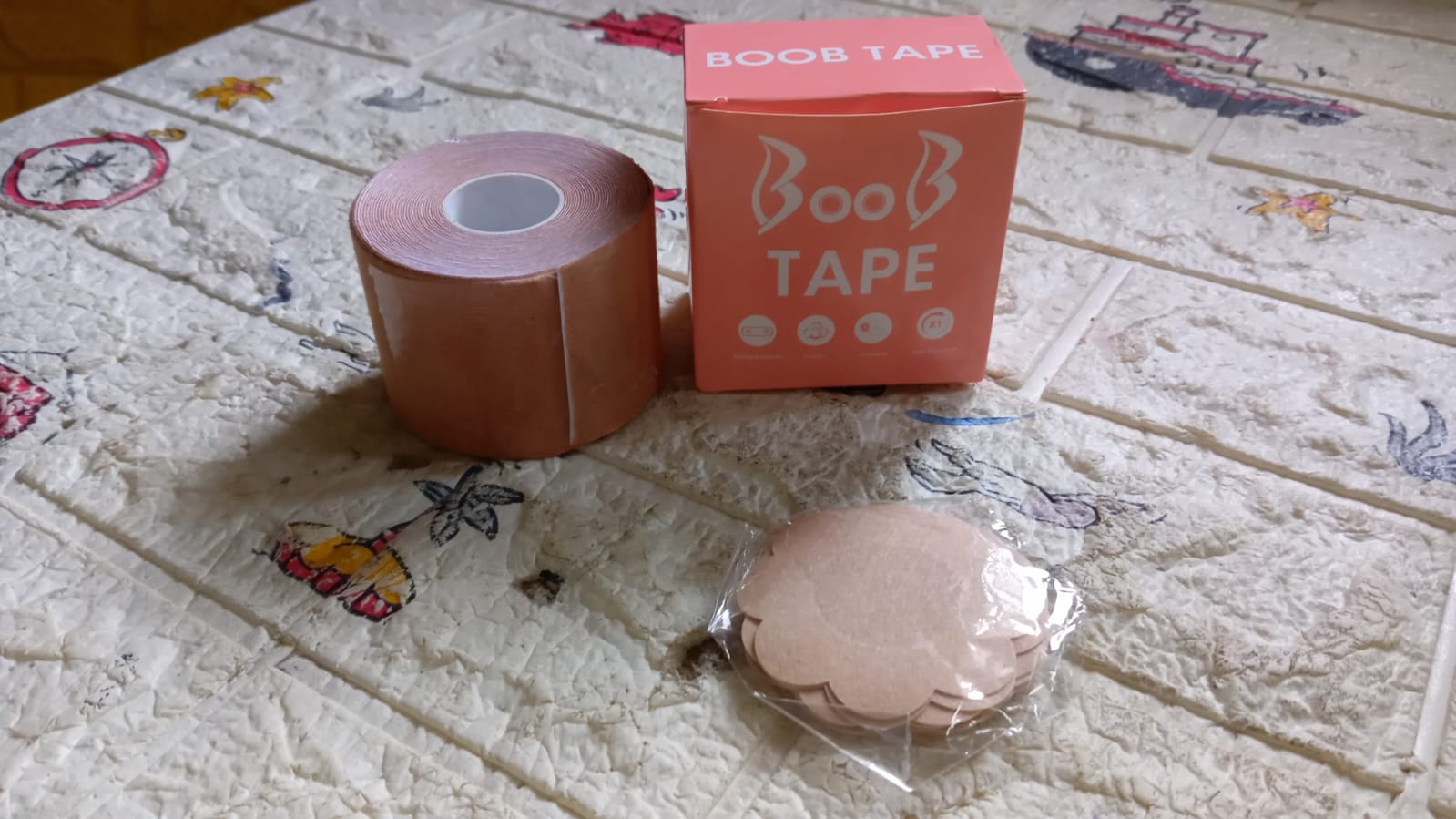 Woman confidently wearing an outfit with the invisible Boob Tape.