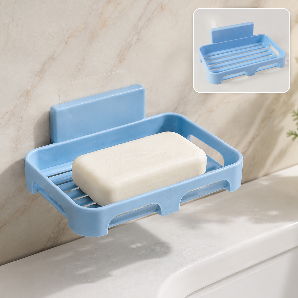 Light blue plastic soap dish with a bar of white soap, mounted on a light marble wall above a sink.