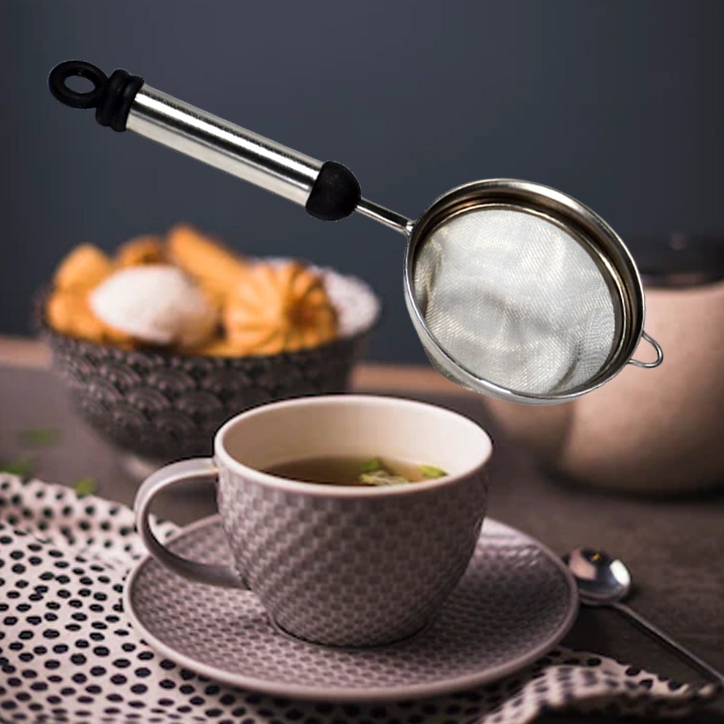 Fine mesh stainless steel strainer ready to filter juice or tea.