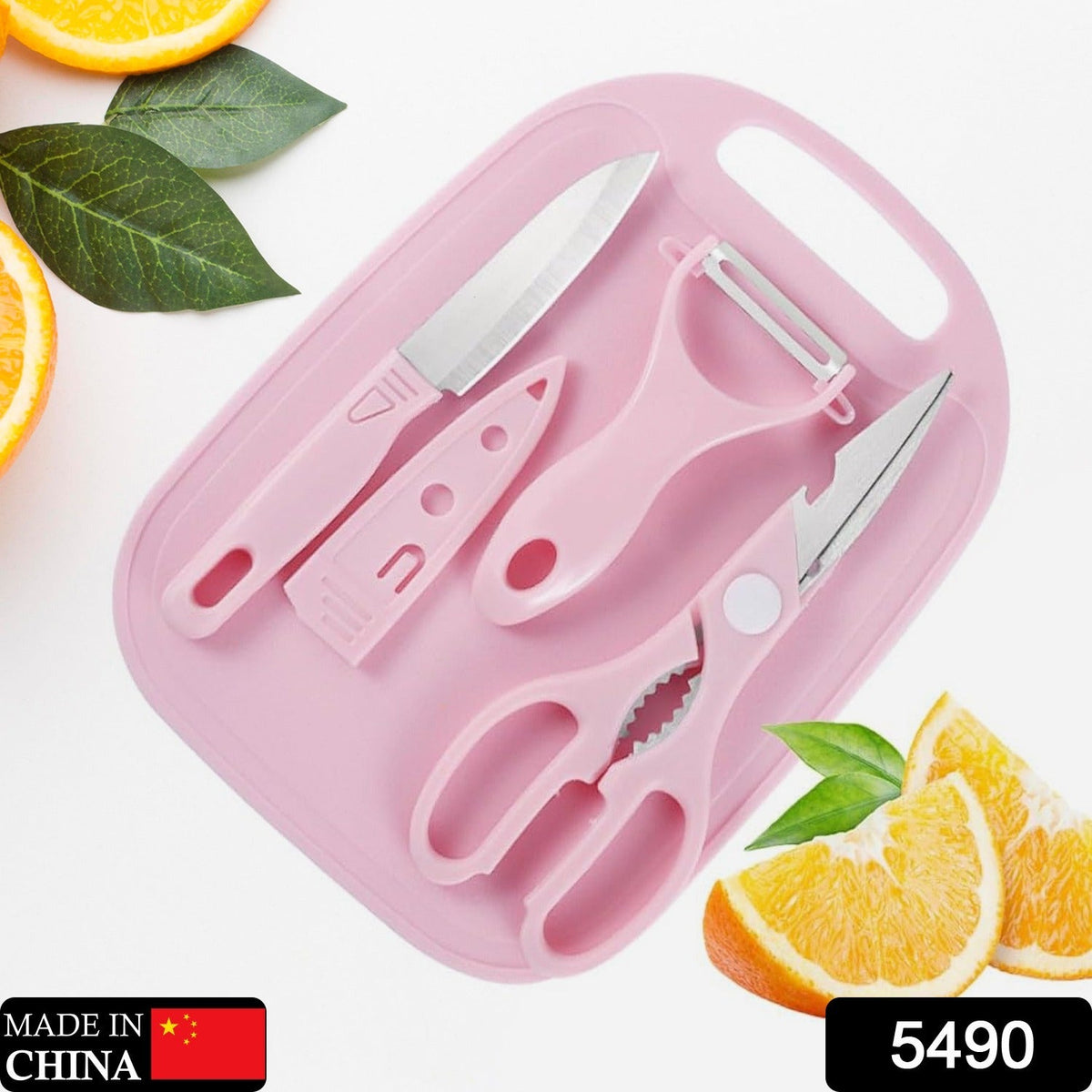 A pink cutting board holds a knife, peeler, and scissors, surrounded by fresh orange slices and green leaves.