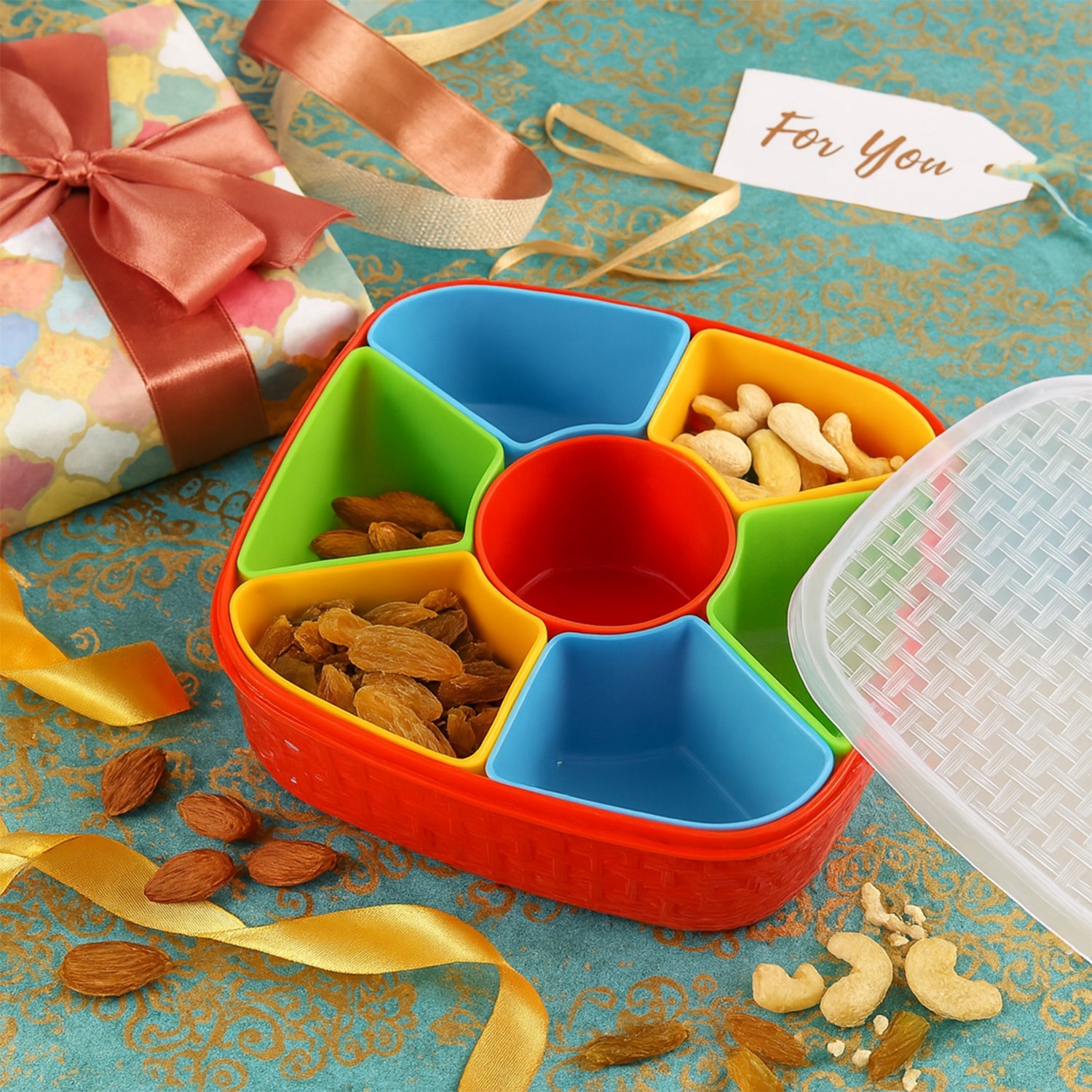 Dry fruit box with lid open revealing inside 7 compartments for snacks