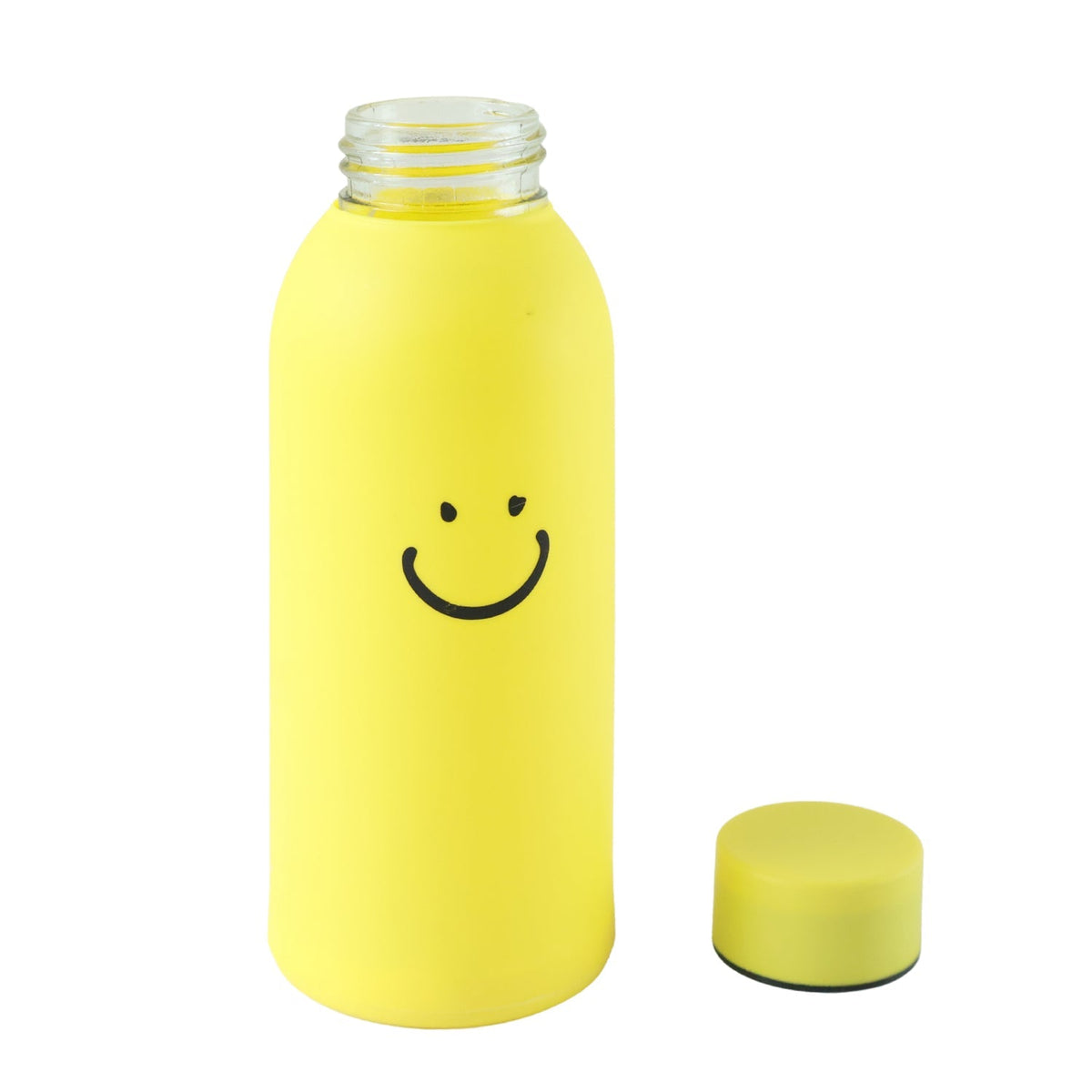 Yellow glass water bottle with a smiley face, with its cap removed and placed beside it on a white background.