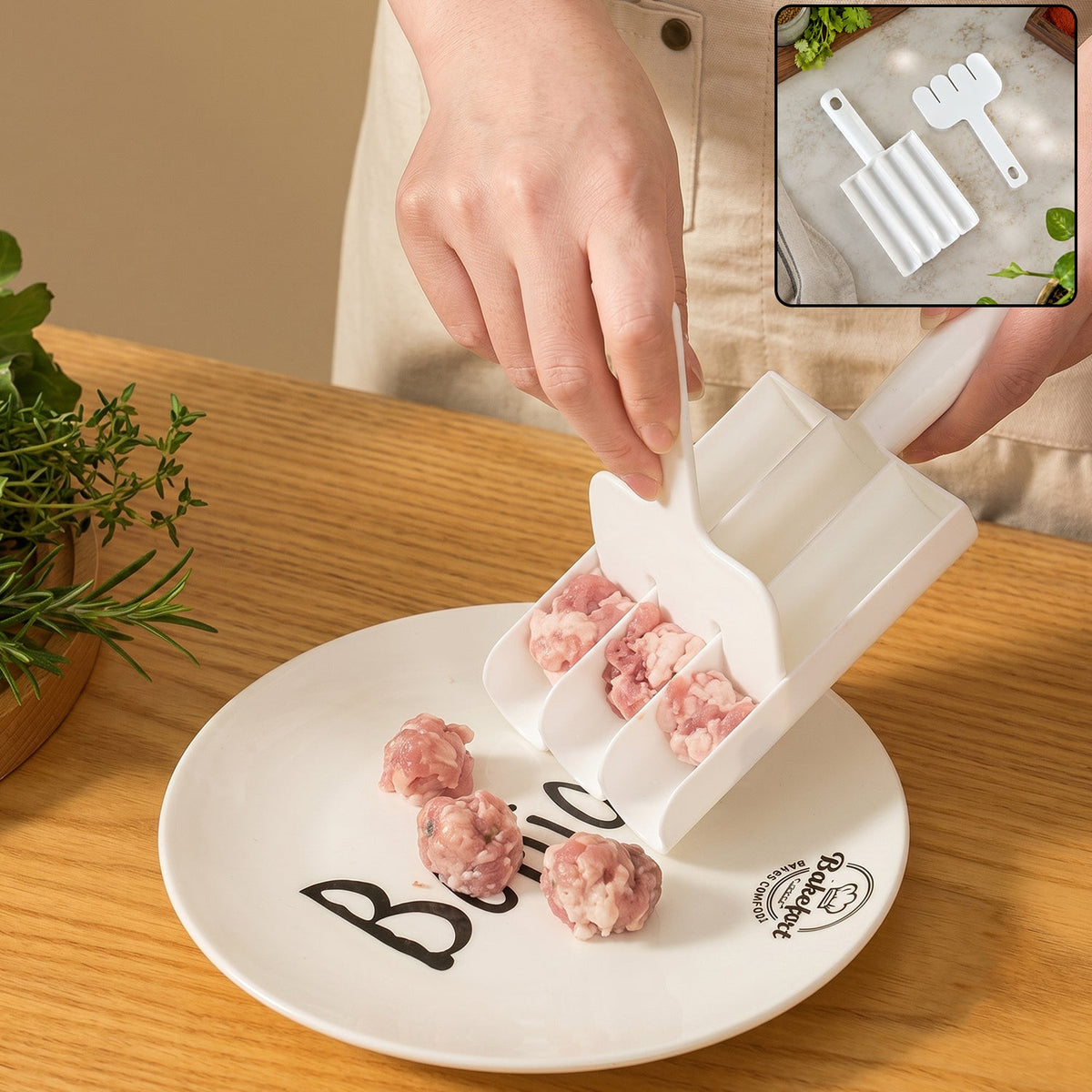 A person uses a white plastic meatball maker to scoop raw ground meat onto a white plate.