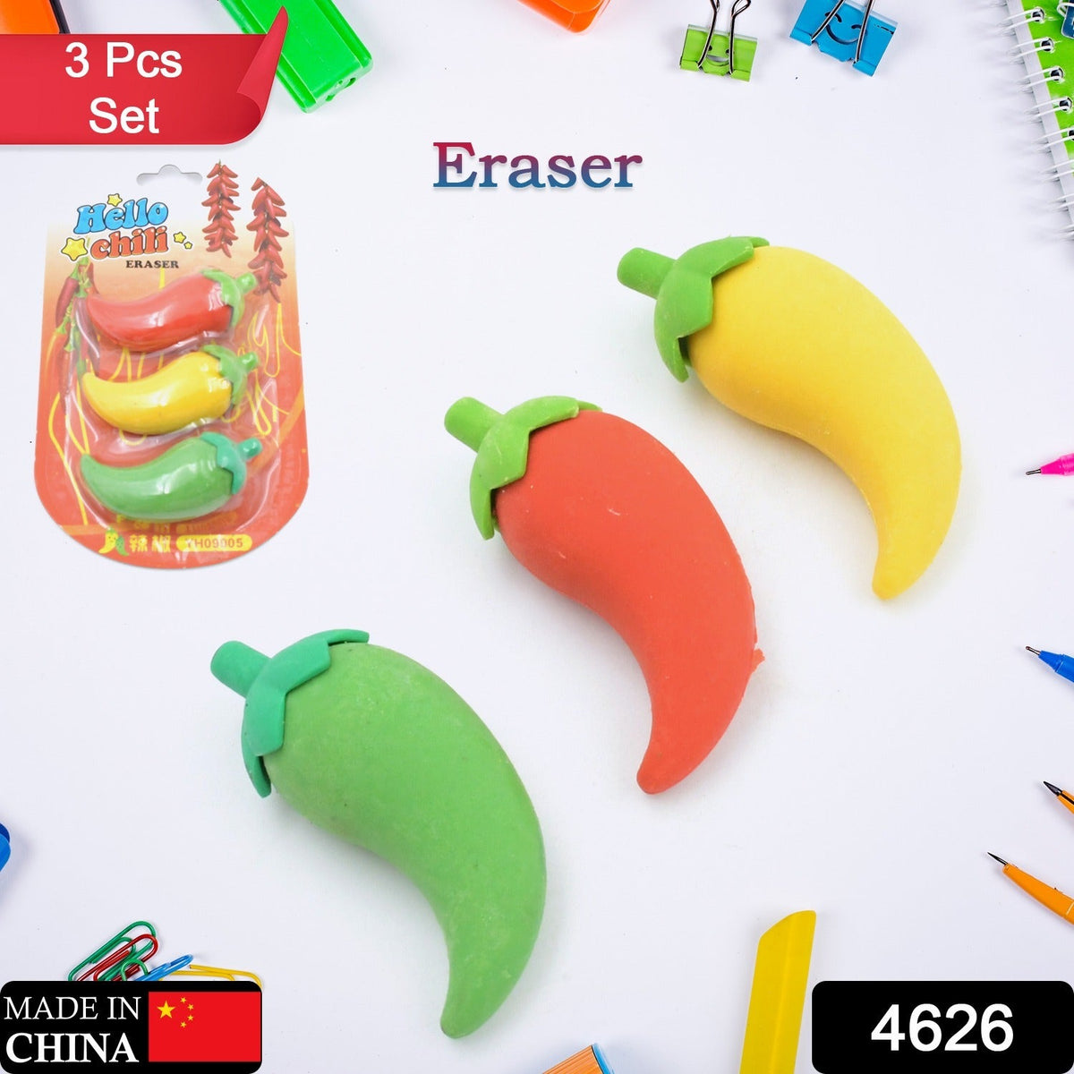 Three chili pepper erasers in red, yellow, and green, with the product packaging and other school supplies scattered around.