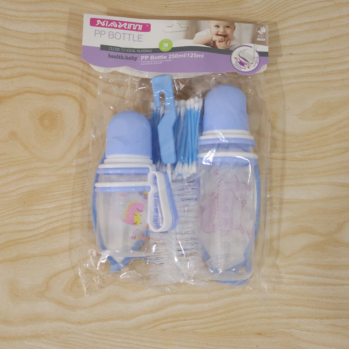 Live photo of plastic baby feeding bottle set