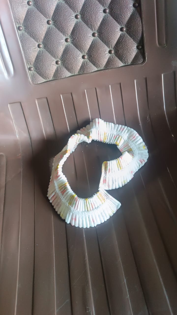 Compactly folded air conditioner dust cover ready for storage after use